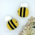 A pair of crocheted bees