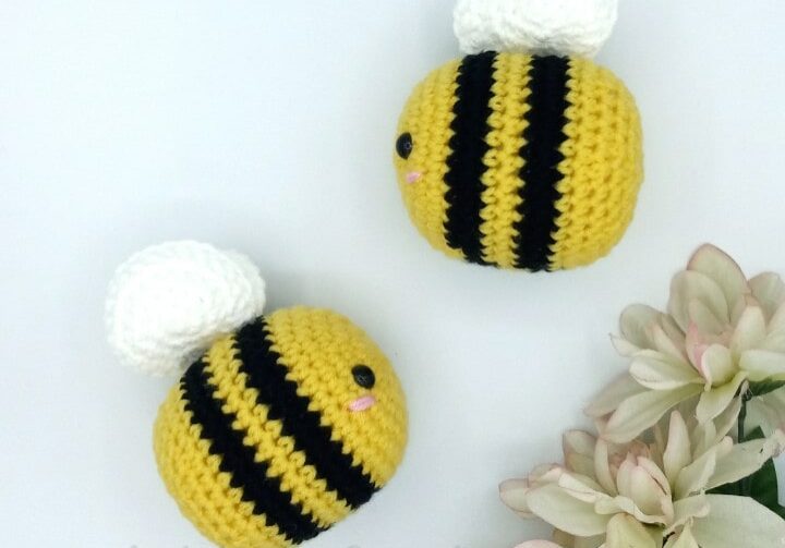 A pair of crocheted bees
